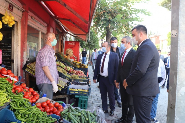 MHP’den esnafa destek ziyareti